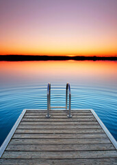 Tranquil Lake View with Wooden Pier at Sunset