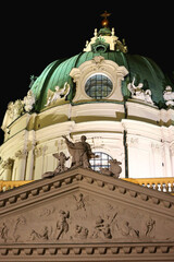St. Charles's Church, baroque landmark in Vienna, Austria, illuminated at night.