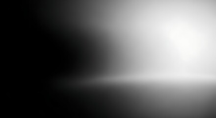 Abstract gradient background with a bright light source transitioning from black to white, creating a sense of depth.