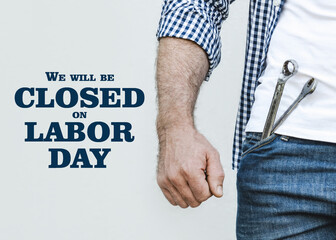 Signboard with the inscription We will be closed on Labor Day. Congratulations for family, loved...