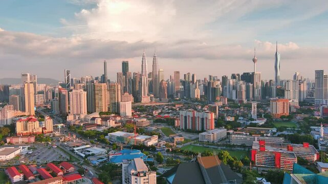 Kuala Lumpur, Malaysia: Aerial view of capital city of Malaysia, modern skyline at sunset, perfect for travel, business, or development projects - landscape panorama of Southeast Asia from above
