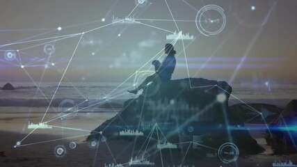 Woman stepping onto rock at sunset activating digital tech overlay adjusting posture gazing ocean - Powered by Adobe