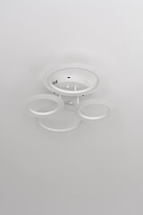 Modern LED chandelier formed from four flat circles. Selective focus. Shallow depth of field.
