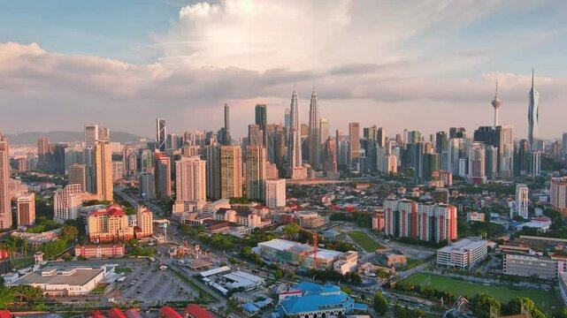 Kuala Lumpur, Malaysia: Aerial view of capital city of Malaysia, modern skyline at sunset, perfect for travel, business, or development projects - landscape panorama of Southeast Asia from above
