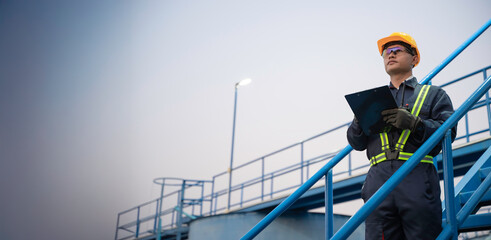 Petrochemical engineer working at petroleum oil refinery industry area. Industrial technician...