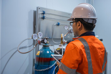 Asian engineer working at Operating hall,Thailand people wear helmet  work,He worked with diligence...