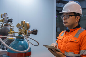 Asian engineer working at Operating hall,Thailand people wear helmet  work,He worked with diligence...