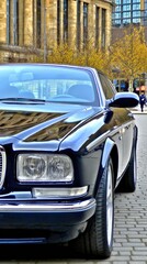 Fototapeta premium Car parked in an outdoor parking lot with autumn trees reflecting in the windshield on a clear day