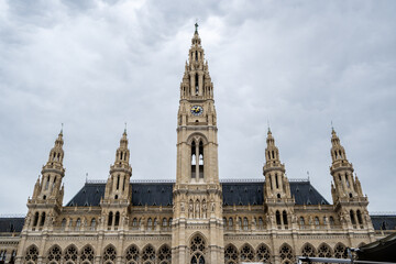 Fototapeta premium Photo shows a part of the Vienna City Hall. Cloudy sky at the background.