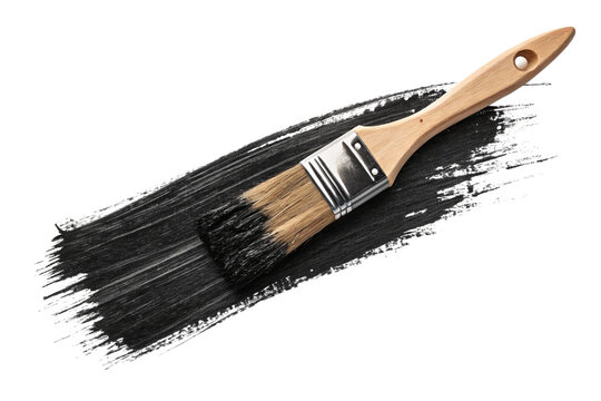 A close-up shot of a paintbrush with black paint isolated on white background