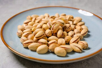 Dry Roasted and Salted Pistachios in ceramic plate