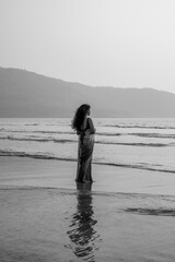 Indian Woman in Saree Looking at the Sea &ndash; Black and White Photo