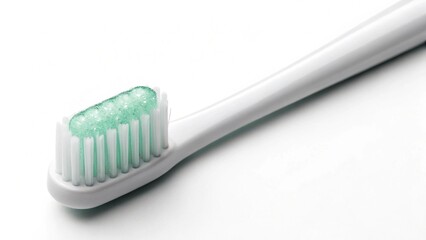 A clean white toothbrush with a perfect dollop of fresh green gel toothpaste, ready for daily oral hygiene. This close-up shot emphasizes cleanliness, dental care, and a healthy routine