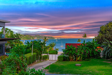 Beautiful view from Kao Khad next to Cape Panwa on the island of Phuket Thailand. Views of the turquoise Blue waters of the Andaman Sea and small islands off the coat of Phuket