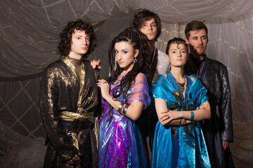 Arabian Nights inspired group portrait, models in authentic Turkish costumes, dreamy setting