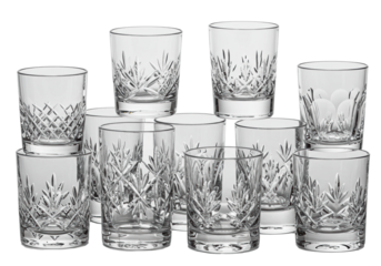 Clear glass tumblers & whiskey glasses, varied heights, intricate diamond-cut, fluted, ribbed & etched designs, brilliant transparency, on a transparent isolated background, no shadows, luxurious
