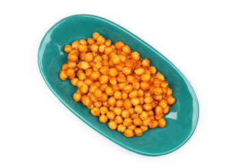Chickpea or nohut dish from legumes in a green plate on a white background.