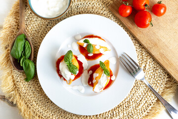 Traditional Italian Conchiglioni pasta with Italian Cheese, Tomato Sauce, and Basil Leaves