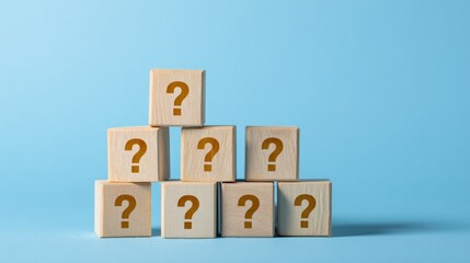 question mark icon on wooden cubes on a blue background,  Q and A, questions and answers concept.