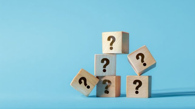 question mark icon on wooden cubes on a blue background,  Q and A, questions and answers concept.