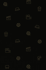 Seamless black background with subtle outlined film and cinema icons including reels cameras popcorn and hats creating a pattern design for movie themed projects
