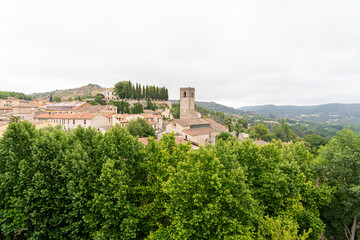 Obraz premium Historic town of Brihuega in Guadalajara, Castilla-La Mancha with lush greenery and cloudy skies