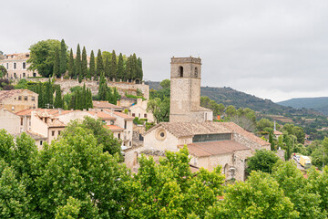 Fototapeta premium Scenic view of Brihuega's historic architecture surrounded by lush greenery in Guadalajara, Spain