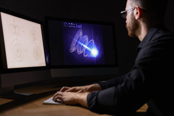 Engineer working with digital drawing at table in office