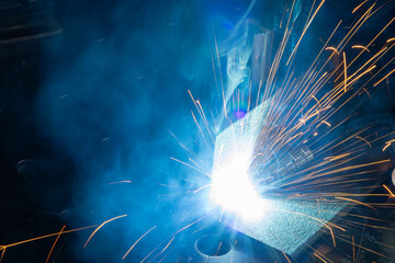  Arc Welding with Blue Smoke and Sparks. Intense arc welding with blue smoke and bright sparks. A...