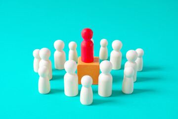 Wooden figure standing ,Concept of business leadership, successful competition.