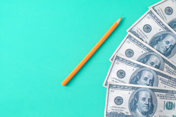 A dollar bills with pencil ,Paying more for your education concept.