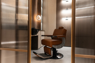 Stylish barber shop interior with modern chair and wooden accents