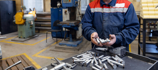 Industrial worker inspector measure detail with in factory workshop