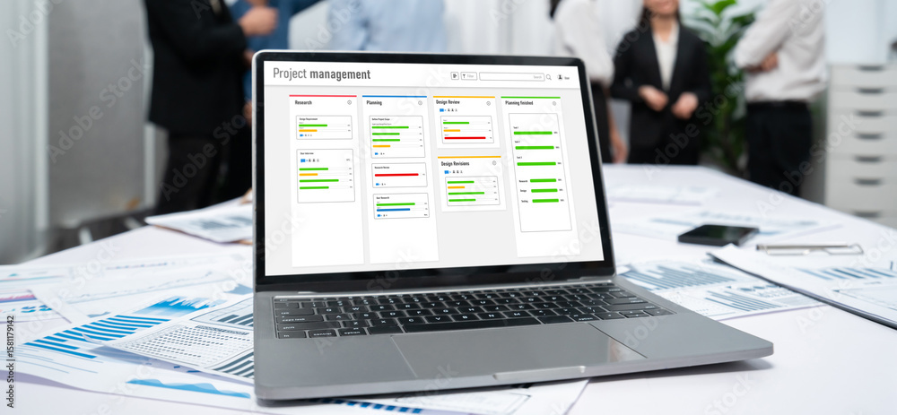 Poster project planning software for brisk business project management on the computer screen showing timel
