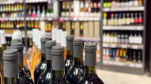 defocused alcohol (wine, champagne, liquor, whiskey) on store shelves