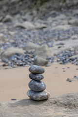 Four stacked stones at the beach along Opal coast in Norhern France