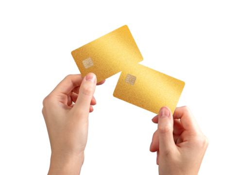 bankcards held in hand. Closeup of yellow debit and credit cards with chip, representing economic