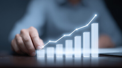 A progressive business performance report illustrated with a luminous bar graph hovering above an executive hand, symbolizing steady growth and strategic success
