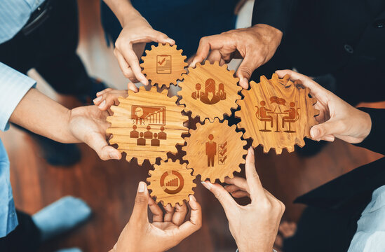 Team Collaboration and Management Concepts with Wooden Gear Icons Representing Strategy, Growth, and Planning in a Professional Setting. Amity