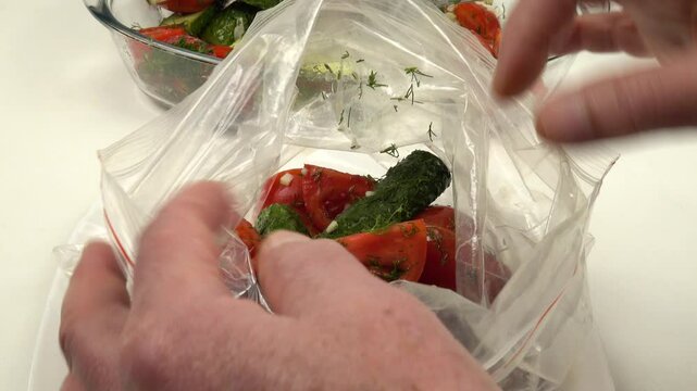 Vegetable salad is being placed in a plastic zipper storage bag for fast pickling and storage