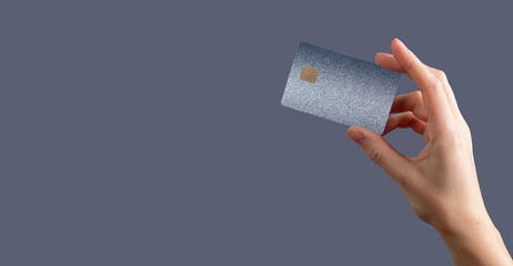 Currency control concept. Bankcard grip, secure fund, finance, profit, credit, cashback, closeup
