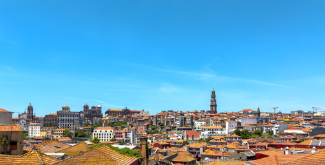 Porto panoramic cityscape with Clerigos tower and cathedral spire, red tiled rooftops, historic old
