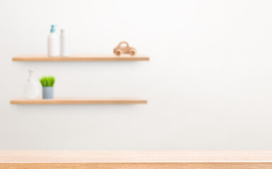 empty table in foreground, wall shelves with care products in background