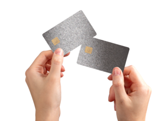 Two bankcards held in hand. Woman showing debit and credit cards with chip for secure payment,