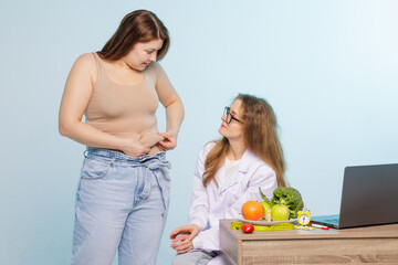 Dietitian and Nutritionist Consulting Overweight Woman About Weight Loss and Healthy Lifestyle