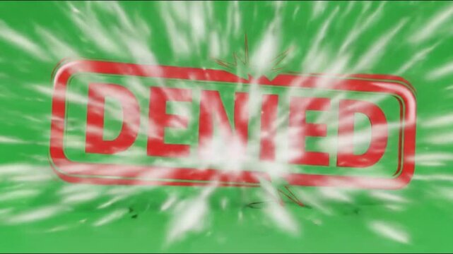 A red neon sign with the word denied on a green background with cracked glass effect