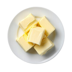 Pieces of butter on a white plate top view clipart