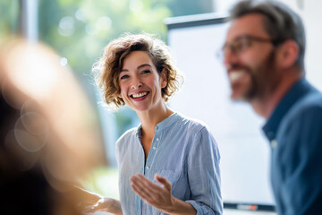 Engaging Presentation: An articulate presenter, bathed in natural light, shares her ideas with an engaged audience, fostering collaborative spirit and knowledge exchange. 