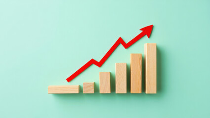 Visualizing Business Growth A Red Arrow Ascends Over Wooden Blocks Representing Increasing Data Points on a Teal Background Symbolizing Positive Trends