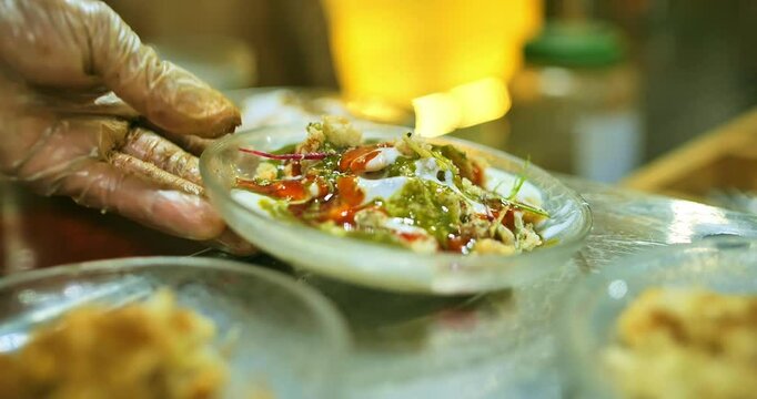 Indian caterers preparing delicious chat, panipuri, and patis at a festive event, showcasing vibrant flavors and traditional street food culture